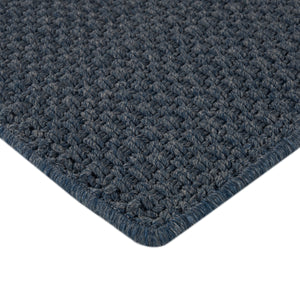 Close-up of teal/green woven rug with intricate loop & knot pattern. - hover