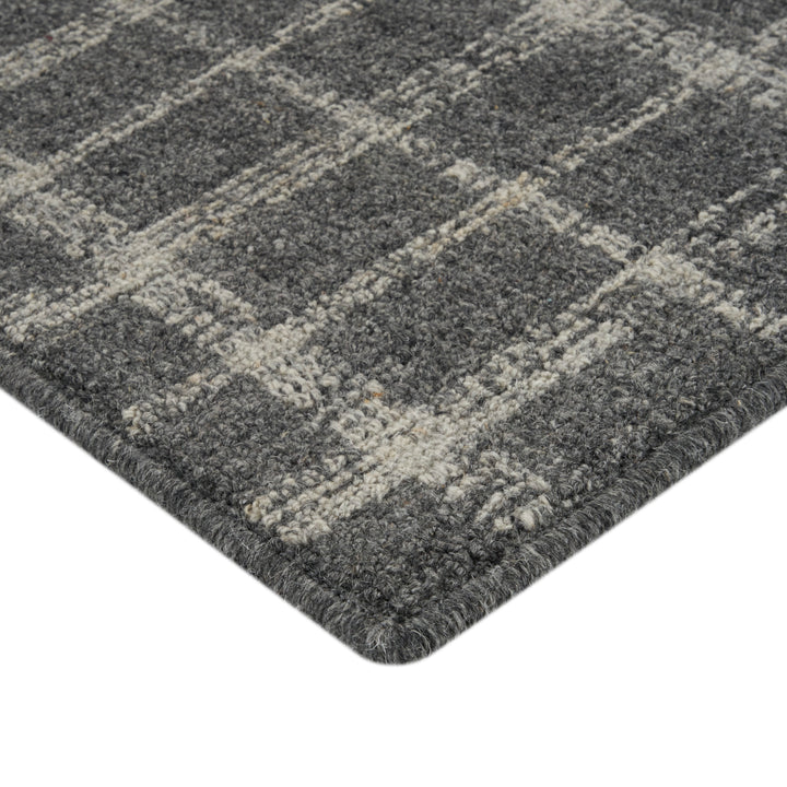 Textured grey carpet with grid pattern, sturdy for high traffic.