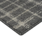 Textured grey carpet with grid pattern, sturdy for high traffic.