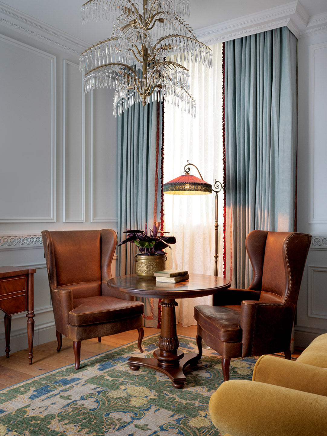 traditional leather chairs, wood table antique rug yellow sofa abc carpet & home