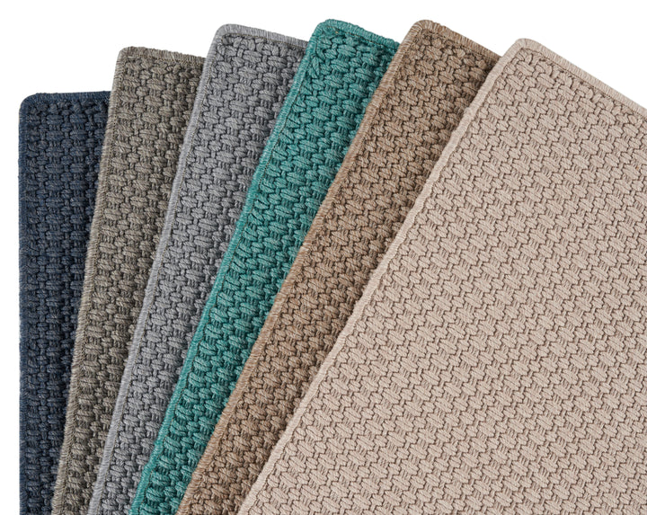 Collection of carpet swatches featuring various colors and textures.