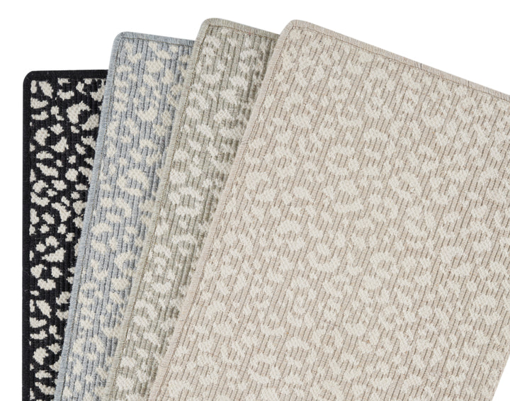 Diverse carpet samples with various patterns and colors on display.