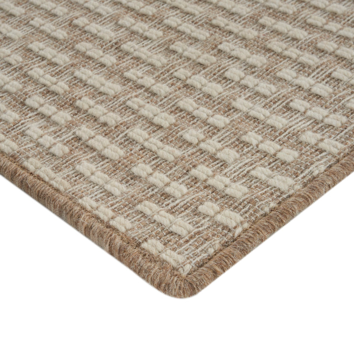Close-up of textured woven rug with fluffy tufts and durable weave