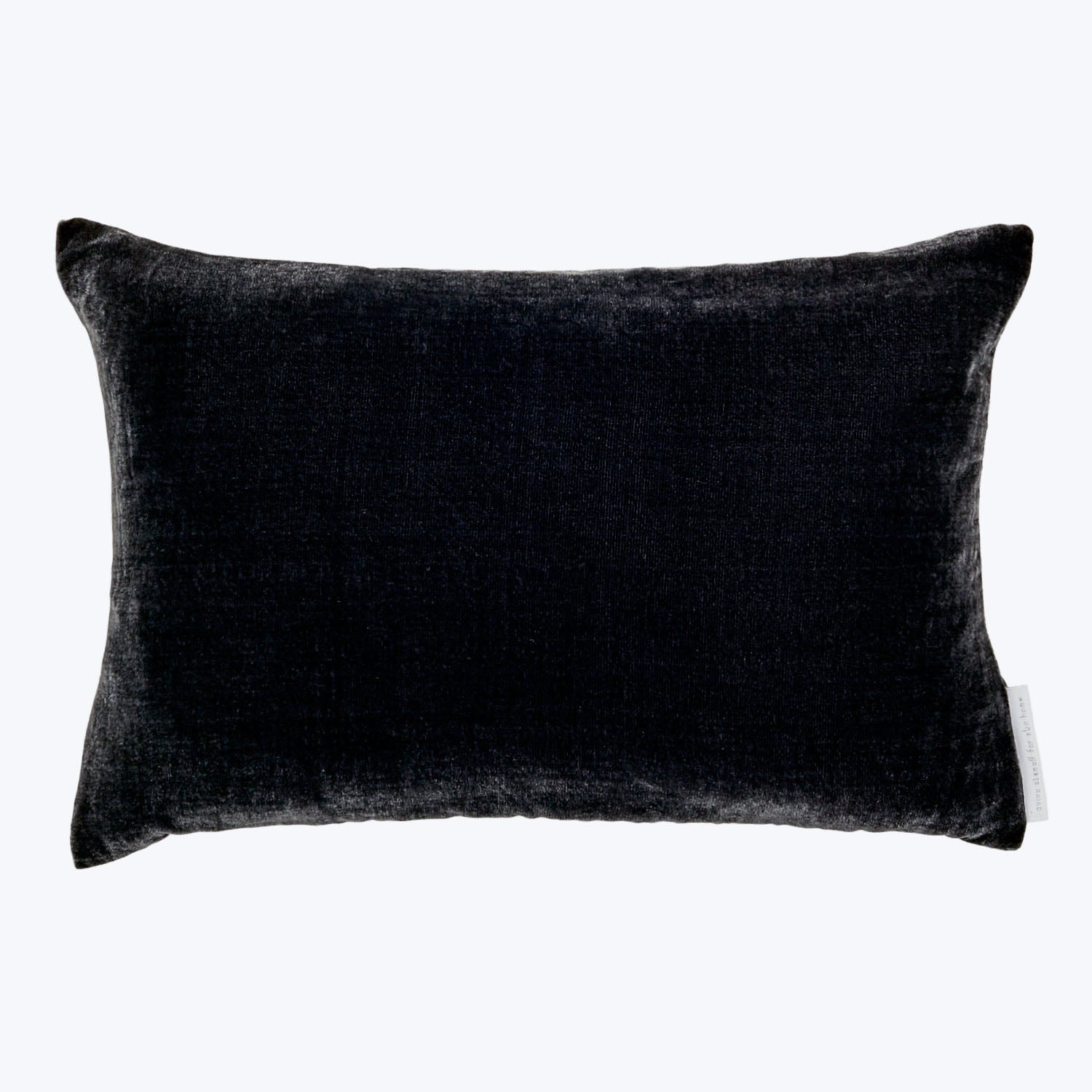 Plush, velvety rectangular pillow in dark color with clean edges.