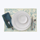 Elegant vintage dinner setting with classic cutlery and table mat