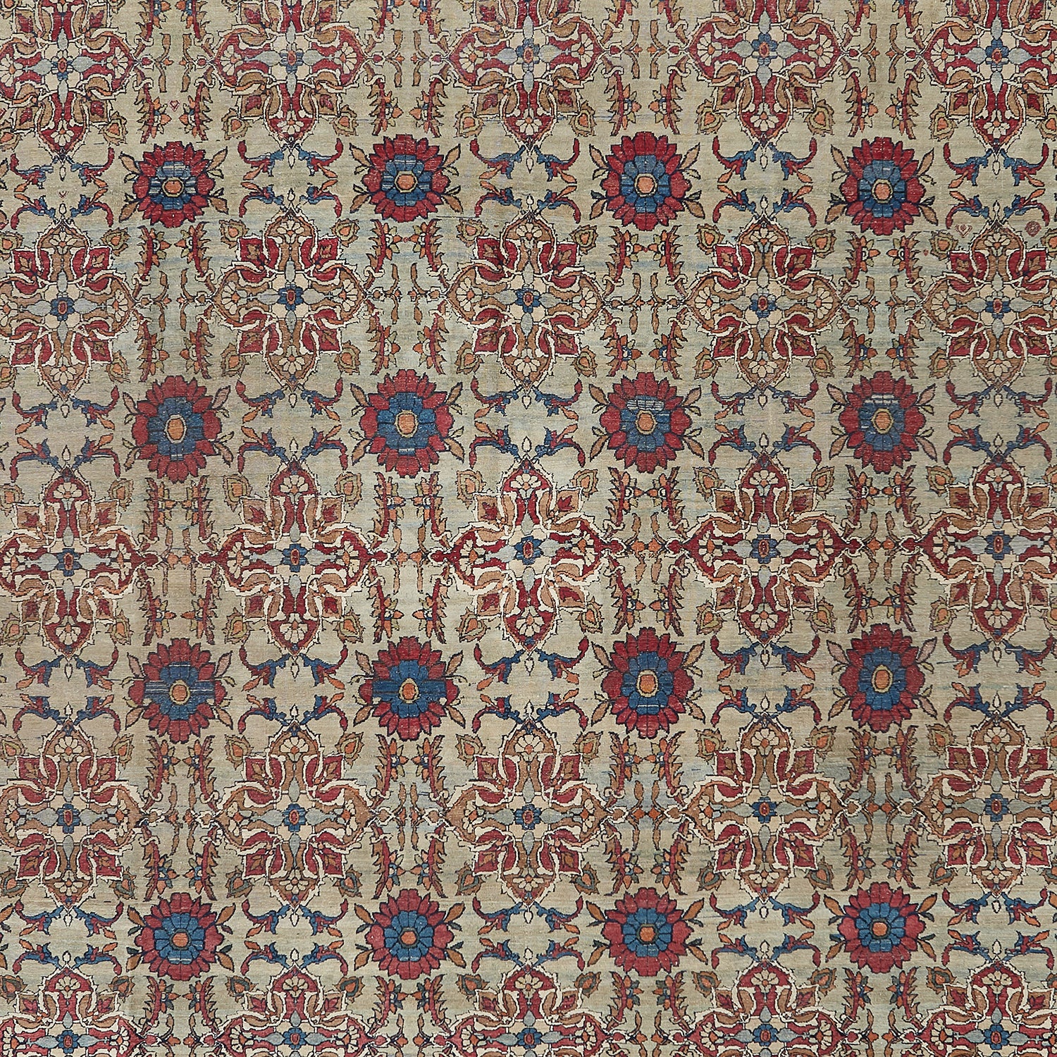 Intricate, stylized fabric pattern with symmetrical floral motifs in red and blue.
