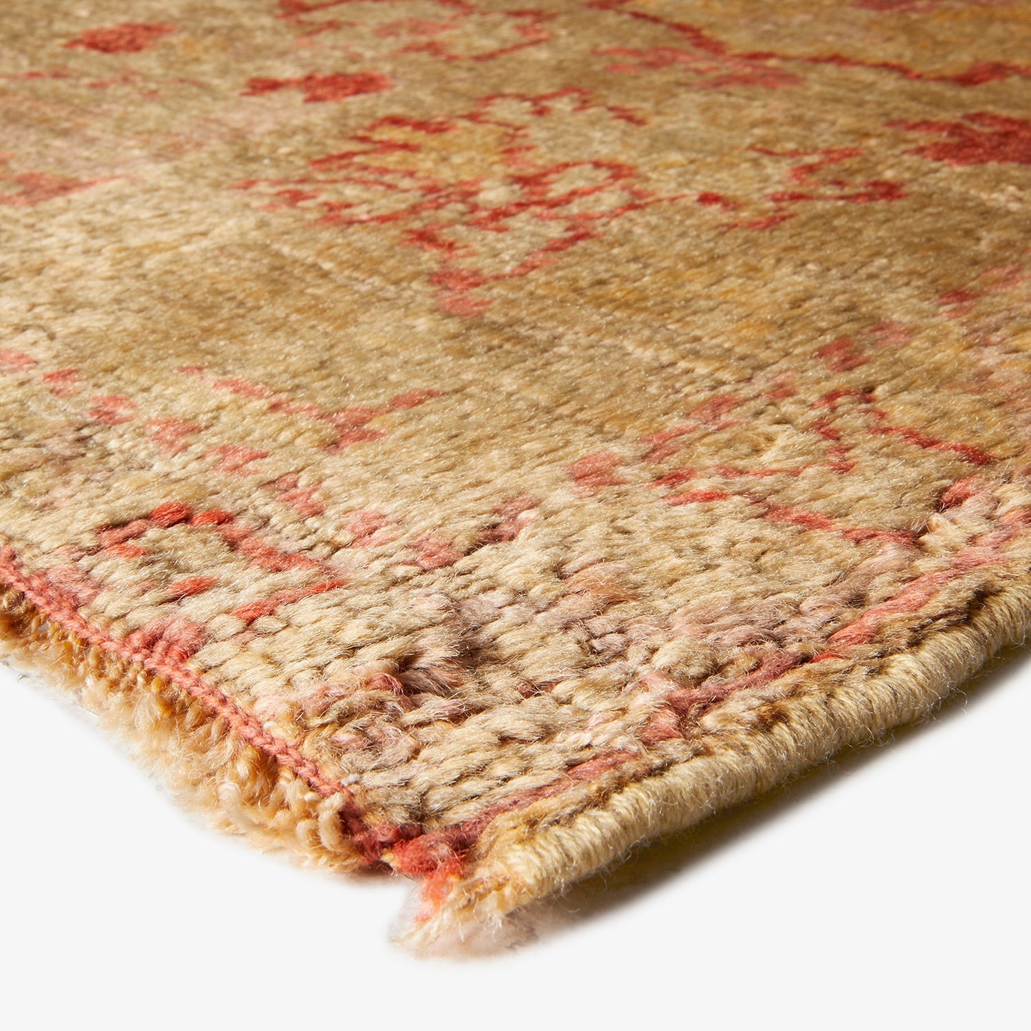 Close-up of a high-quality, textured rug with traditional design.