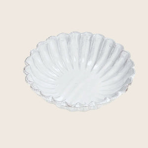 Scallop shell shaped dish with ridged pattern, glossy finish, decorative.