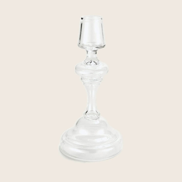 Elegant glass candlestick holder with classic design and transparent appearance.