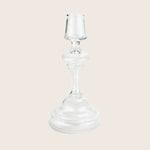 Elegant glass candlestick holder with classic design and transparent appearance.