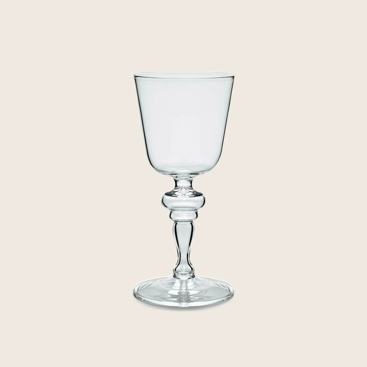Elegant, tulip-shaped glass goblet with decorative stem for formal occasions