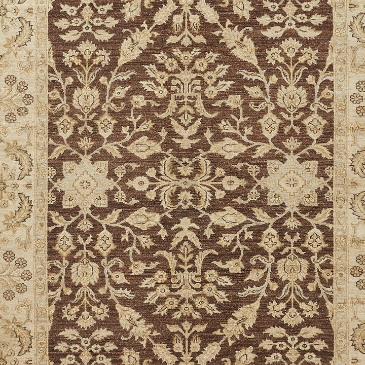 Close-up of intricately patterned, high-quality rug with traditional motifs.