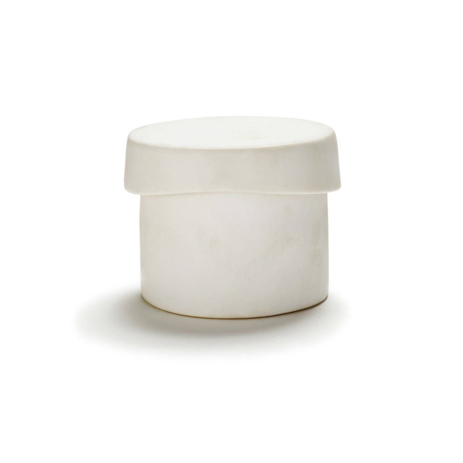 Minimalistic white container with secure lid, photographed on flat surface.