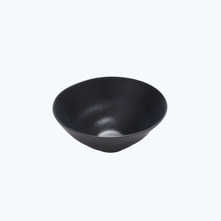 Minimalistic black bowl with matte finish on white background.