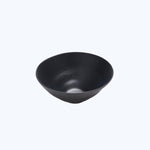 Minimalistic black bowl with matte finish on white background.