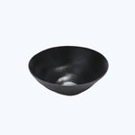 Modern black bowl with a smooth, reflective surface and minimalist design.