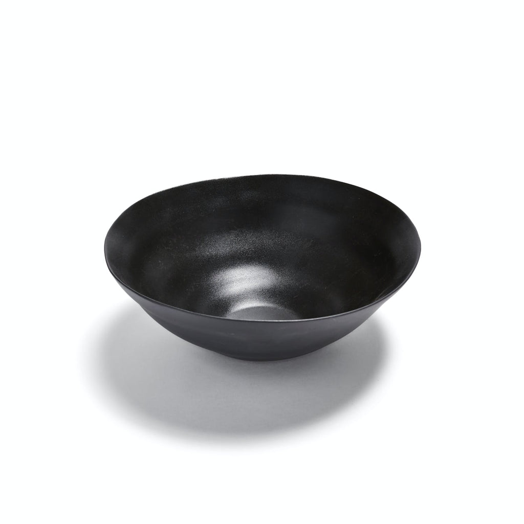 Minimalist black bowl with matte finish on white background.