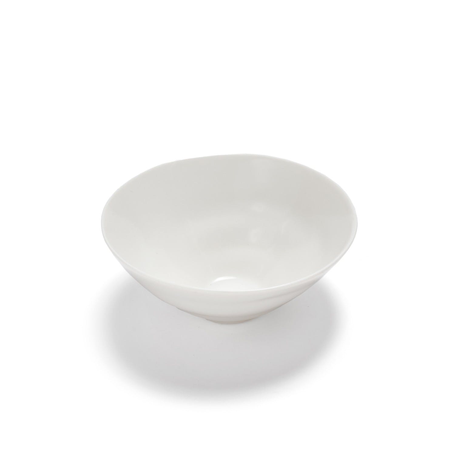 Plain white ceramic bowl with a glossy finish on display.