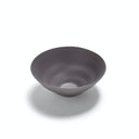 An empty matte gray bowl with a shallow, curved design.