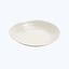 Minimalistic white plate with a gentle curved rim on neutral background.