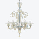 Elegant traditional chandelier with delicate candle-like bulbs suspended from the ceiling.