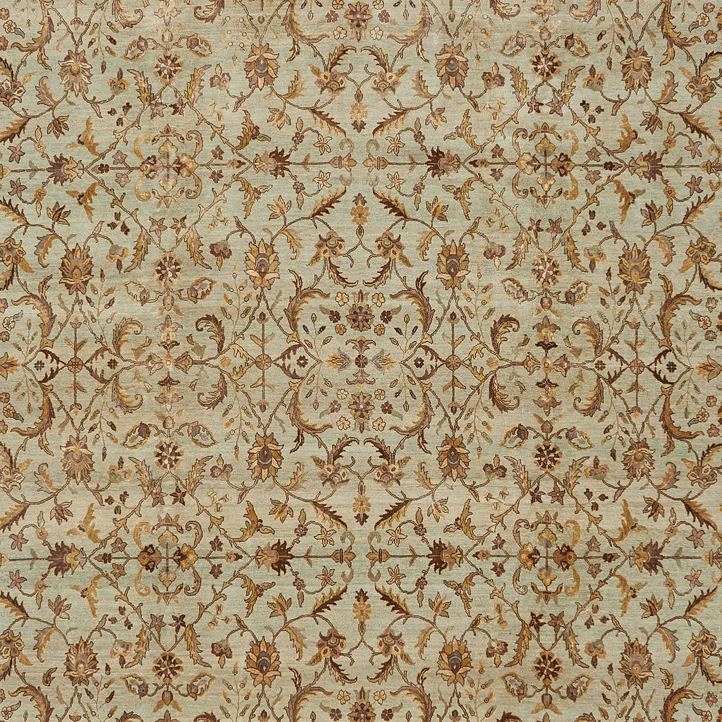 Close-up of an ornate floral and vine patterned carpet.