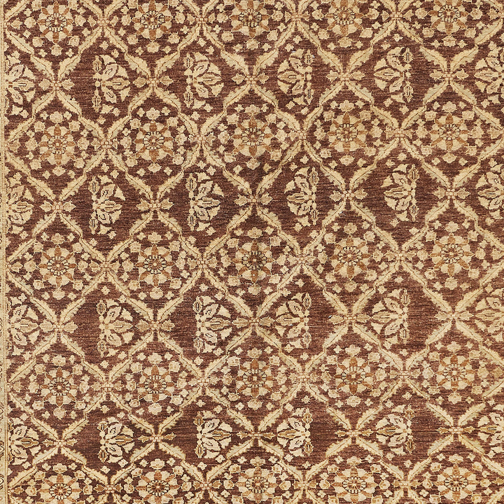 Exquisite geometric carpet with floral motifs in shades of brown.