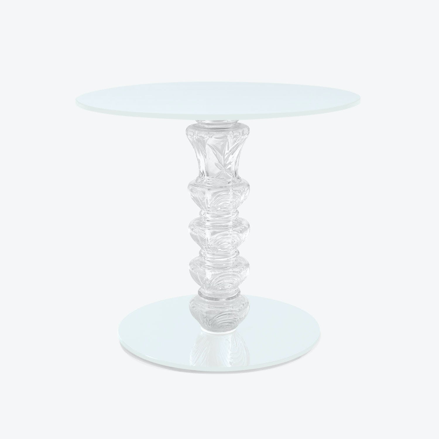 Minimalist glass table with frosted top and elegant sculpted base.