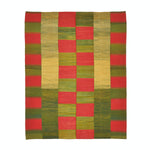 Vibrant green and red checkerboard textile with textured appearance.