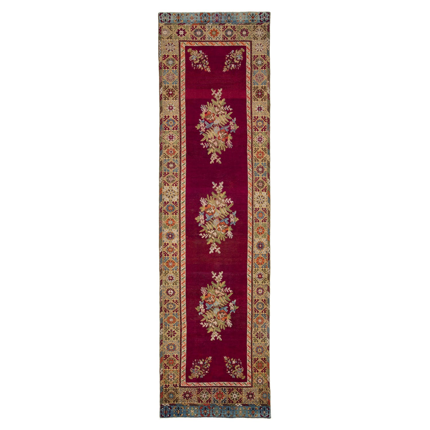Rich maroon runner rug with symmetrical floral motifs and ornate border.