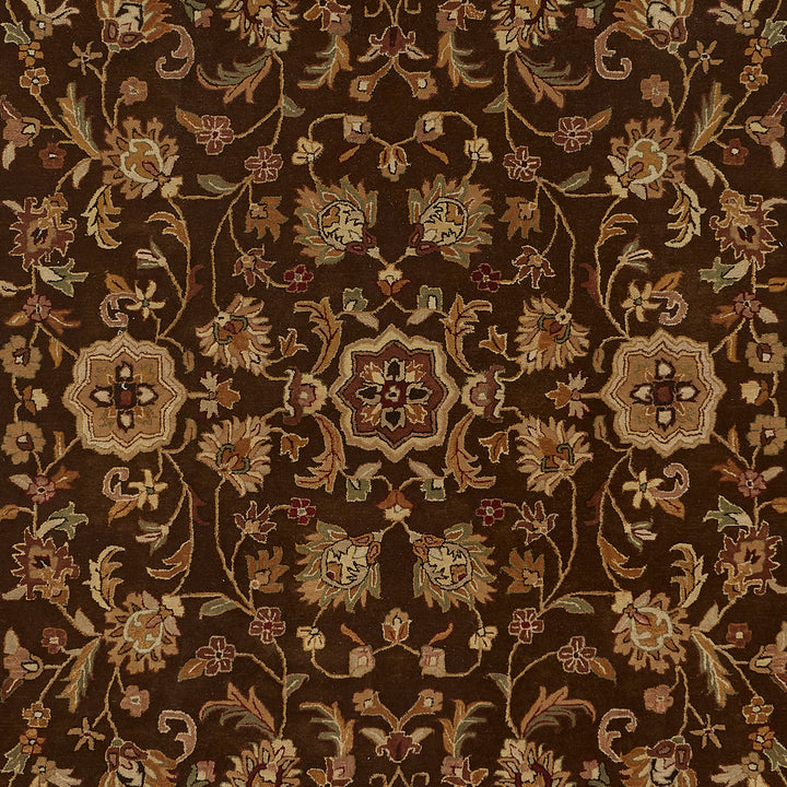 Intricately designed traditional rug with floral motifs exuding opulence and craftsmanship.