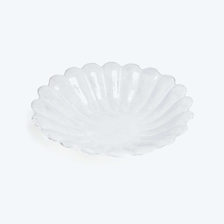White scalloped dish with shell design, elegant and decorative piece.