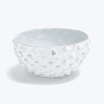 White bowl with bubbly texture, irregular edge, artisan quality design.