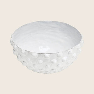 Textured white ceramic bowl with raised bumps and shiny glaze.