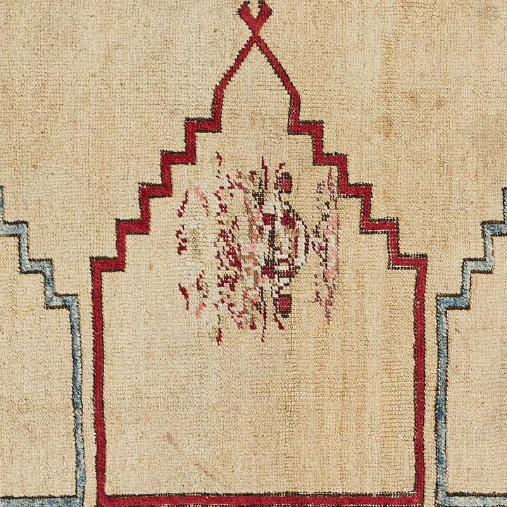 Intricate symmetrical woven textile with geometric patterns in red and beige