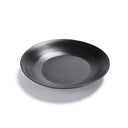 Plain black matte plate with shallow bowl shape and soft reflection.