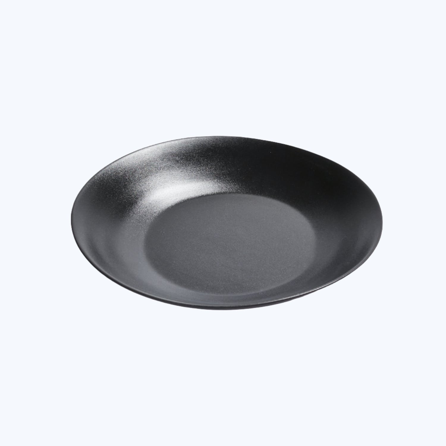 Plain black matte plate with shallow bowl shape and soft reflection.