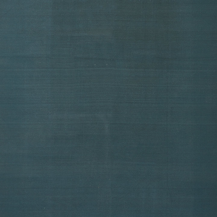 Close-up of dark blue fabric with subtle uniform weave pattern.