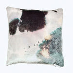 Square pillow with animal hide-inspired design in rustic colors.
