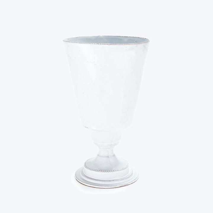Transparent glass goblet on white background, elegant and detailed design.