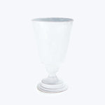 Transparent glass goblet on white background, elegant and detailed design.