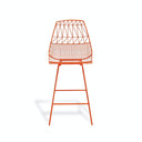 Modern orange bar stool with geometric wire design showcases minimalist style.