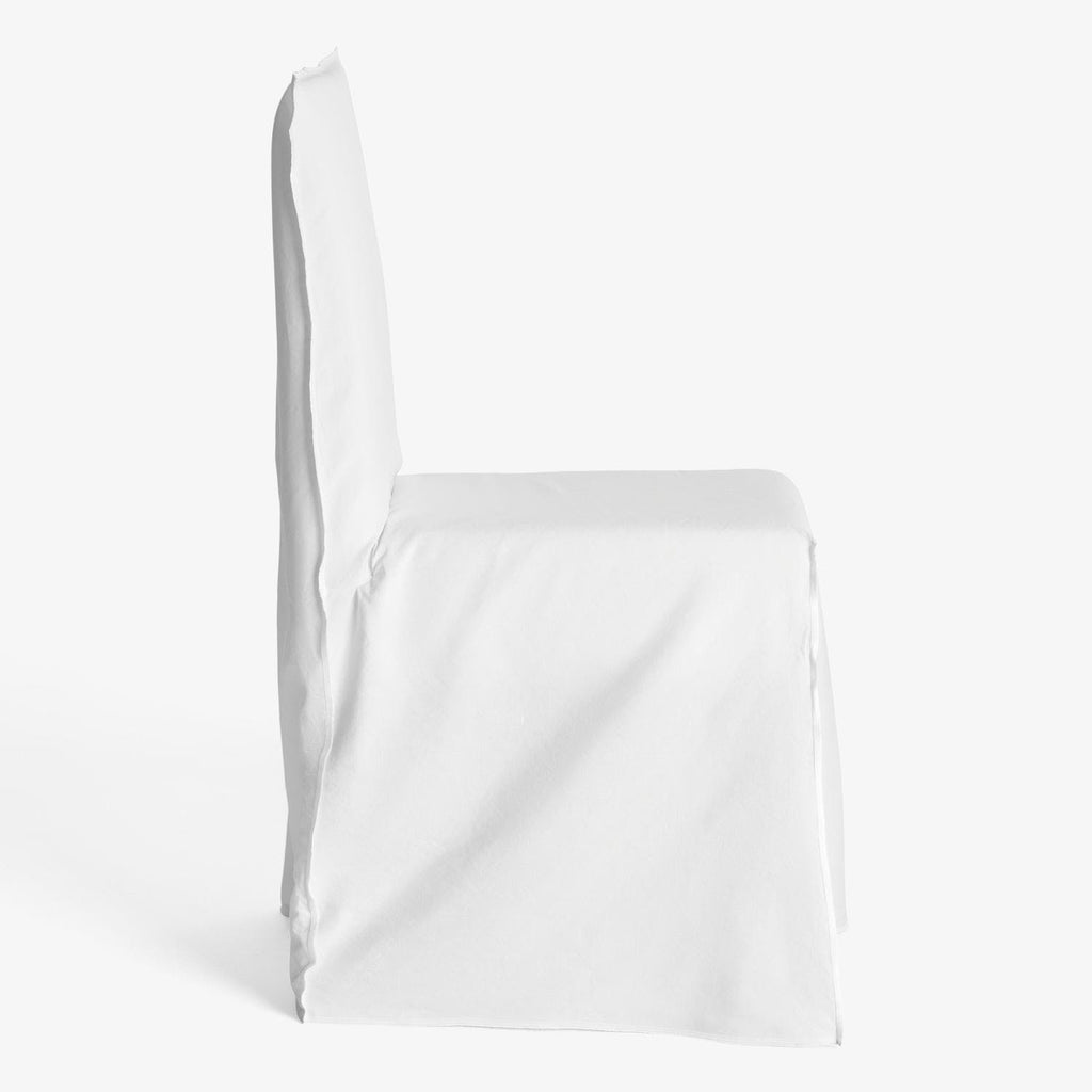 Minimalistic white chair covered in a smooth, lightweight cloth.