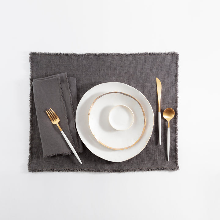 Modern elegance showcased in a sophisticated table setting with gold accents.