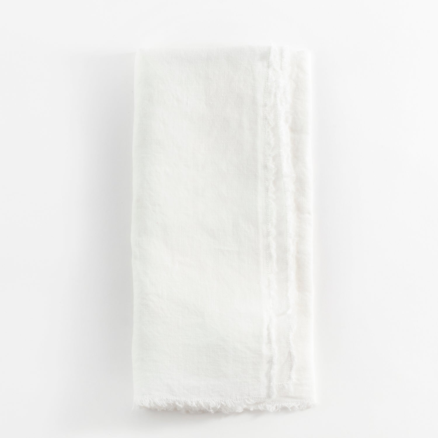 Soft, textured white fabric with a casual, frayed edge.