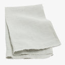 Natural, beige linen cloth with textured appearance and frayed edges.