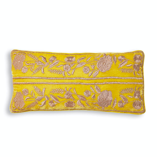 Vibrant yellow pillow with intricate floral embroidery in contrasting tones.