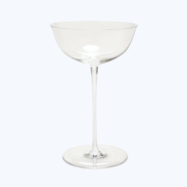 Classic martini glass with elegant design on a white backdrop.