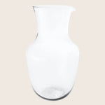 A versatile transparent glass pitcher with a sleek, modern design.