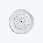 Hand-crafted flower frog with floral design on translucent glass material.